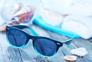 Image showing sun glasses and flip flops 