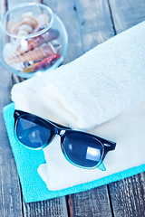 Image showing sun glasses and flip flops 