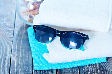 Image showing sun glasses and flip flops 