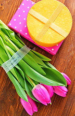 Image showing present and tulips