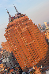 Image showing USA, NEW YORK CITY - April 27, 2012  Bottom up amazing view of Manhattan skyscraper. Midtown Manhattan, or simply Midtown, represents the middle portion of the borough and island of Manhattan in New Y