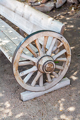 Image showing antique bench made from carriage wheel 