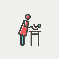 Image showing Woman changing the baby diaper thin line icon