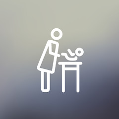 Image showing Woman changing the diaper thin line icon