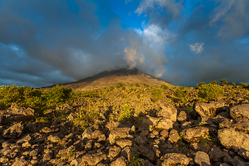 Image showing Clouds over the volcanic mountain 