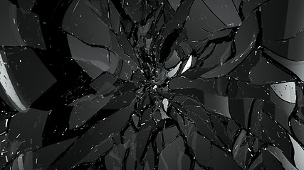 Image showing Pieces of broken or cracked glass on black