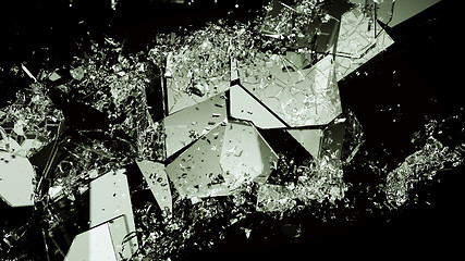 Image showing Pieces of broken or demolished glass on black