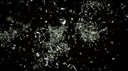 Image showing Many Pieces of splitted or cracked glass on black