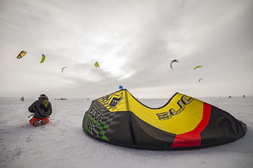 Image showing Kiteboarder with kite on the snow