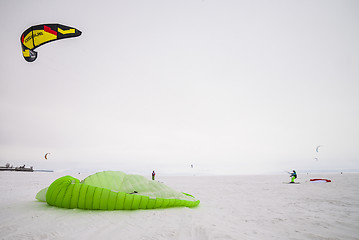 Image showing Kiteboarder with kite on the snow