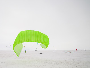 Image showing Kiteboarder with kite on the snow