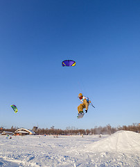 Image showing Kiteboarder with kite on the snow