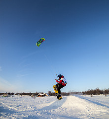 Image showing Kiteboarder with kite on the snow