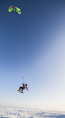 Image showing Kiteboarder with kite on the snow