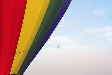 Image showing hot air balloons floating in the morning sky