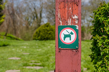 Image showing Dog in leash sign