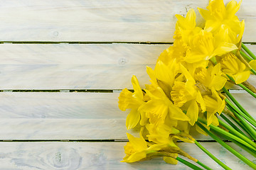 Image showing Daffodils flowers on wood