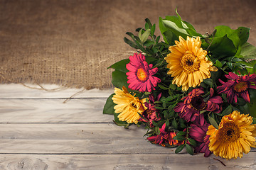 Image showing Flower bouquet on wood