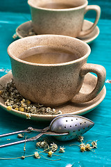 Image showing tea brewed with chamomile in ceramic mugs