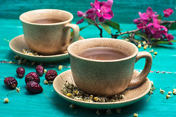 Image showing tea brewed with chamomile in ceramic mugs