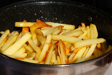 Image showing Roasted potato chips in a metal frying pan