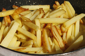 Image showing Roasted potato chips in a frying pan