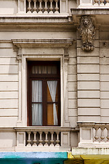 Image showing  old window little terrace colors and head of lion