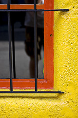 Image showing  old red window and iron grate