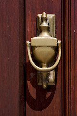 Image showing  brass knocker and wood in colonia del sacramento 
