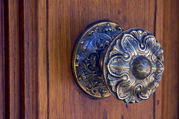 Image showing brass brown knocker and wood  door