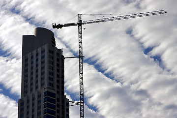 Image showing skyscraper clouds and crane 