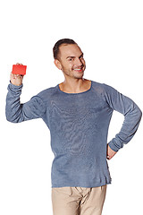 Image showing Smiling casual man showing blank credit card