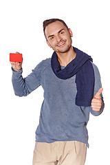 Image showing Smiling casual man showing blank credit card