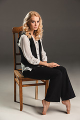 Image showing Beauty blond woman on chair