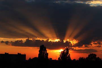 Image showing beautiful summer sunset with dark sky and sun