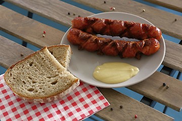 Image showing delicious sausages with bread