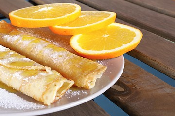 Image showing pancakes with oranges