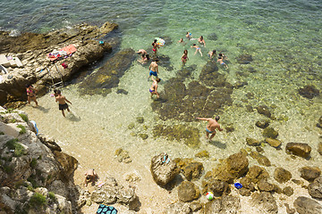 Image showing People bathing on beach in Rovinj