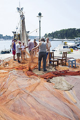 Image showing Fishermen on dock 