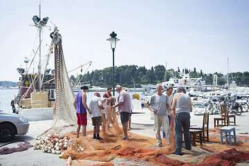 Image showing Fishermen on dock in Rovinj 