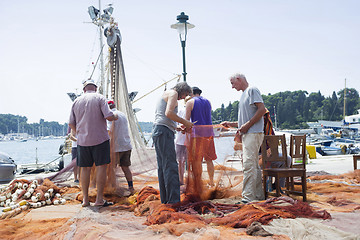 Image showing Fishermen with driftnet on dock in Rovinj 