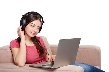 Image showing Woman on sofa using laptop