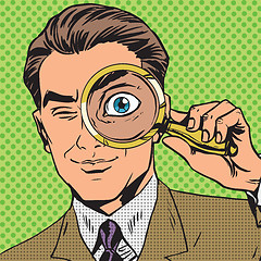 Image showing The man is a detective looking through magnifying glass search p