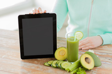 Image showing close up of woman with tablet pc and vegetables