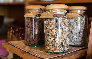 Image showing close up of jars with granola at grocery store