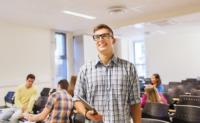 Image showing group of smiling students in lecture hall