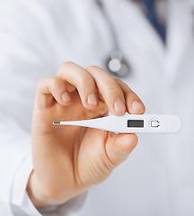 Image showing male doctor with thermometer