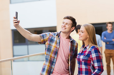 Image showing group of smiling students outdoors