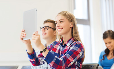 Image showing group of smiling students with tablet pc