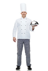 Image showing happy male chef cook holding cloche